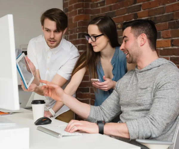 executives-discussing-over-digital-tablet-in-office